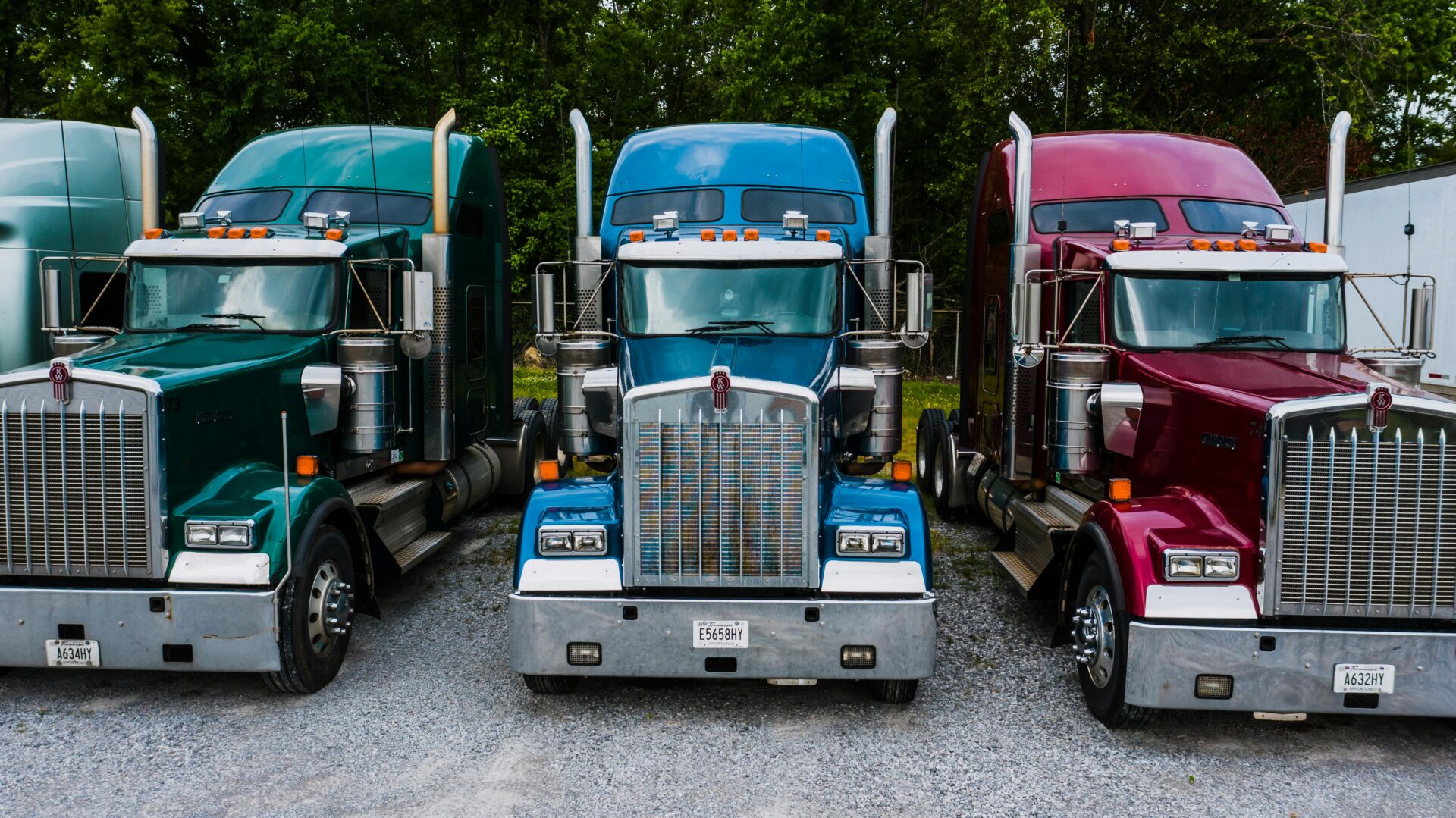 blue purple and green semi trucks